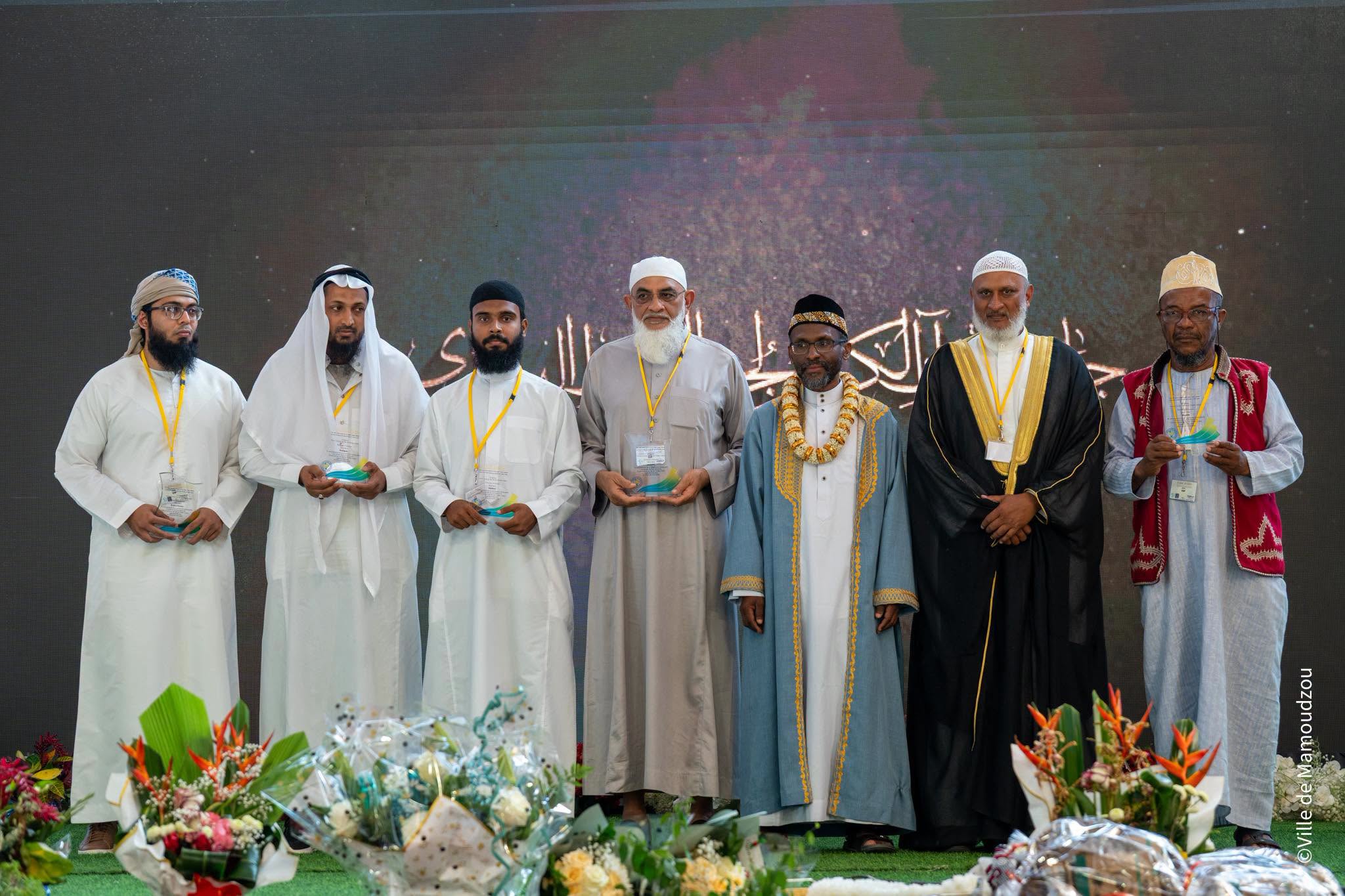 Group photo of each island's representative on stage